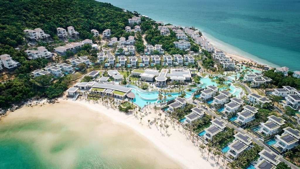 aerial-photography-of-resort-with-villas-near-sea-1488297 Stunning aerial view of a luxurious beach resort with villas and pools on tropical coastline in Vietnam.